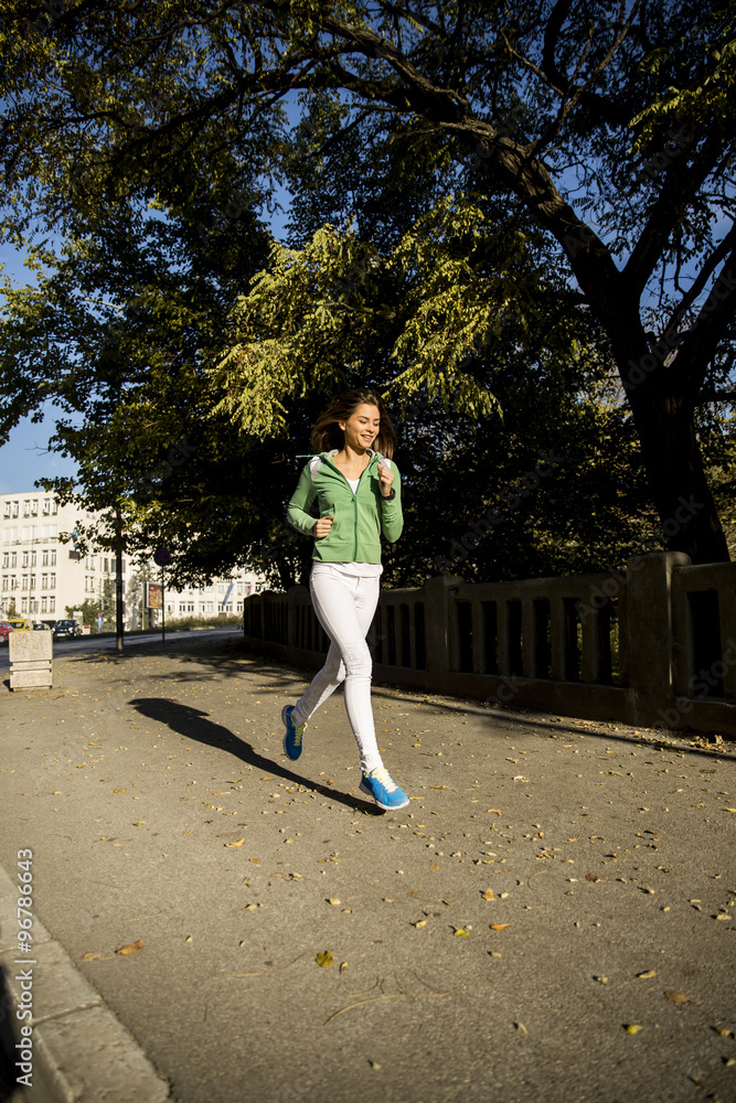 Young woman running in the park Young woman running in the park