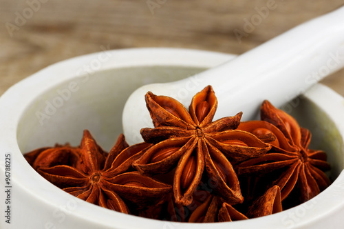 Star Anise in white mortar and pestle photo