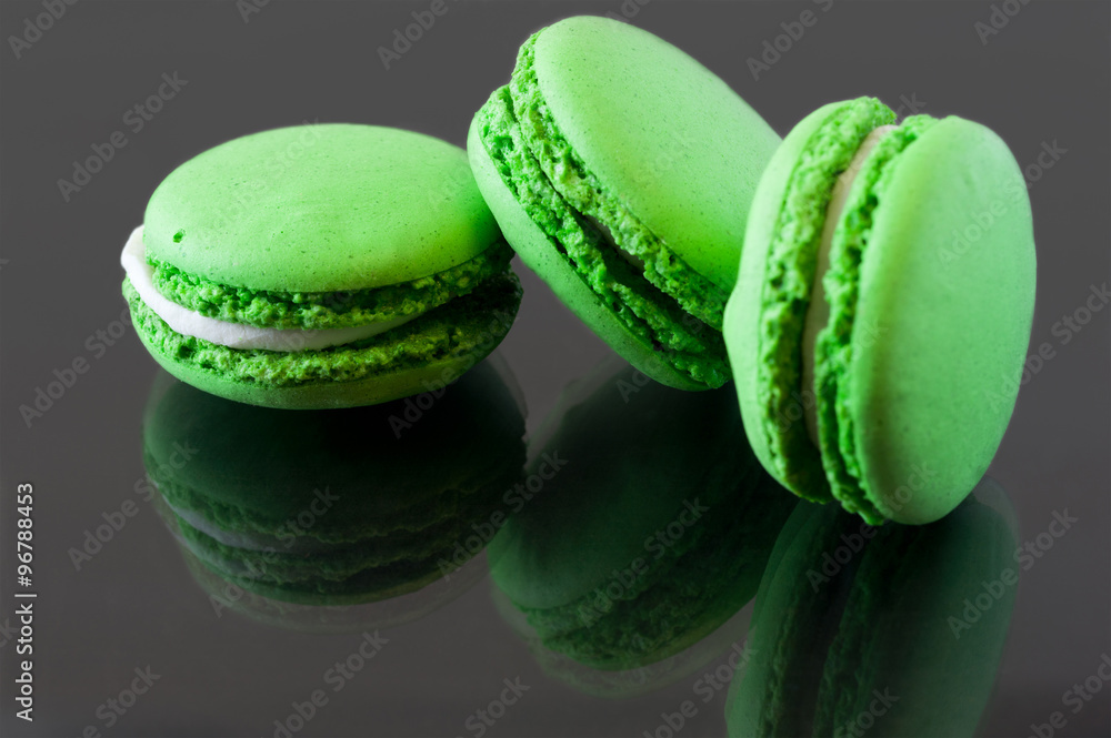 Colorful French Macarons on a dark background Colorful French Macarons on a dark background