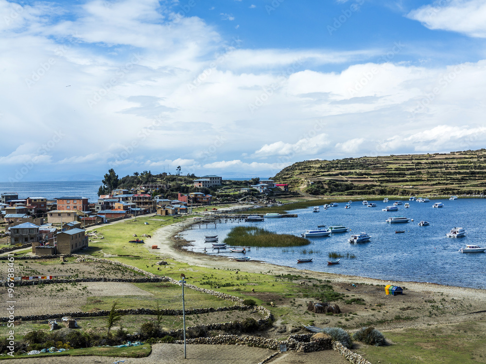 view to Titicaca lake at  Isla del Sol with small village Yumani