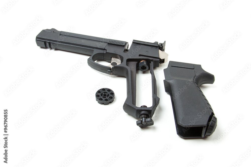 Disassembled gun, isolated