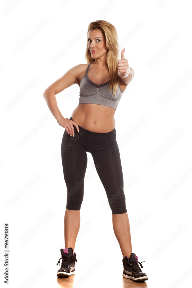 pretty athletic blonde showing thumbs up pretty athletic blonde showing thumbs up