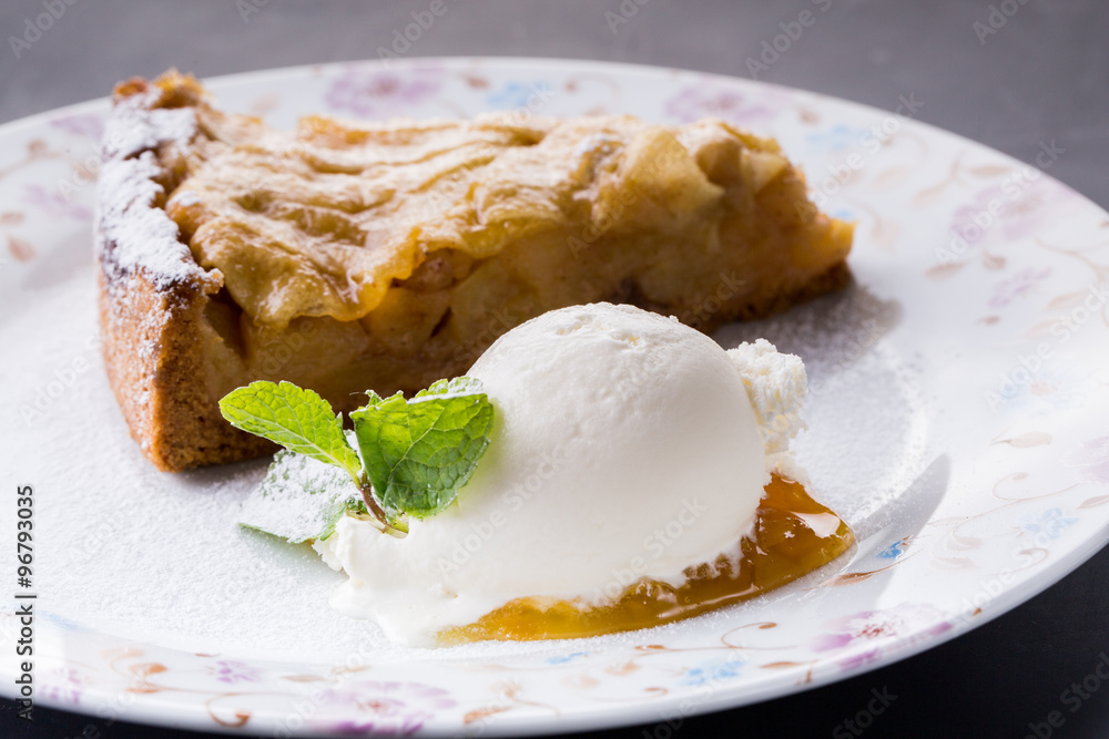 Piece of cake charlotte with apples ice cream and fresh mint on Piece of cake charlotte with apples ice cream and fresh mint on