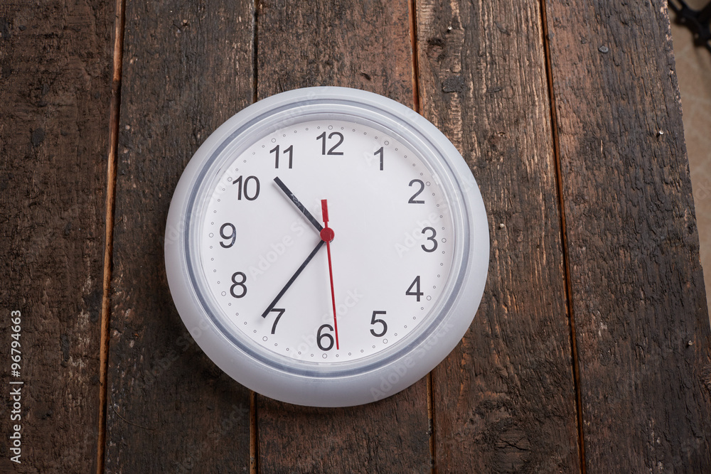 clock on a wooden wall clock on a wooden wall