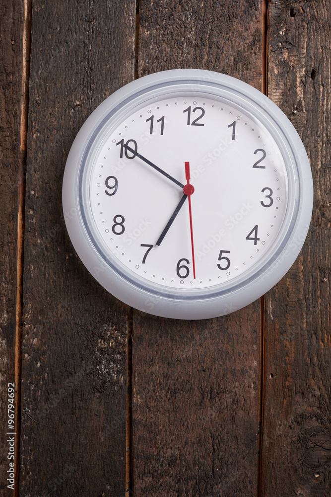 clock on a wooden wall clock on a wooden wall