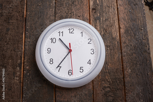 clock on a wooden wall