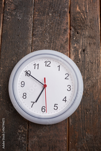 clock on a wooden wall