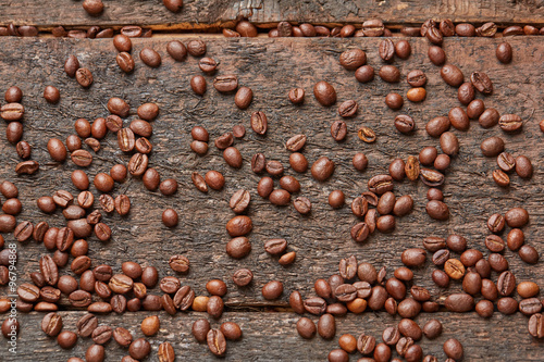 coffee beans scattered on the wooden table