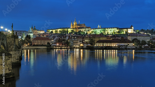 Prague  Czech Republic. Evening view of the Prague Castle with St. Vitus Cathedral  Castle district  Mala Strana district with St. Nicholas Church  and Charles Bridge with Mala Strana Bridge Towers.