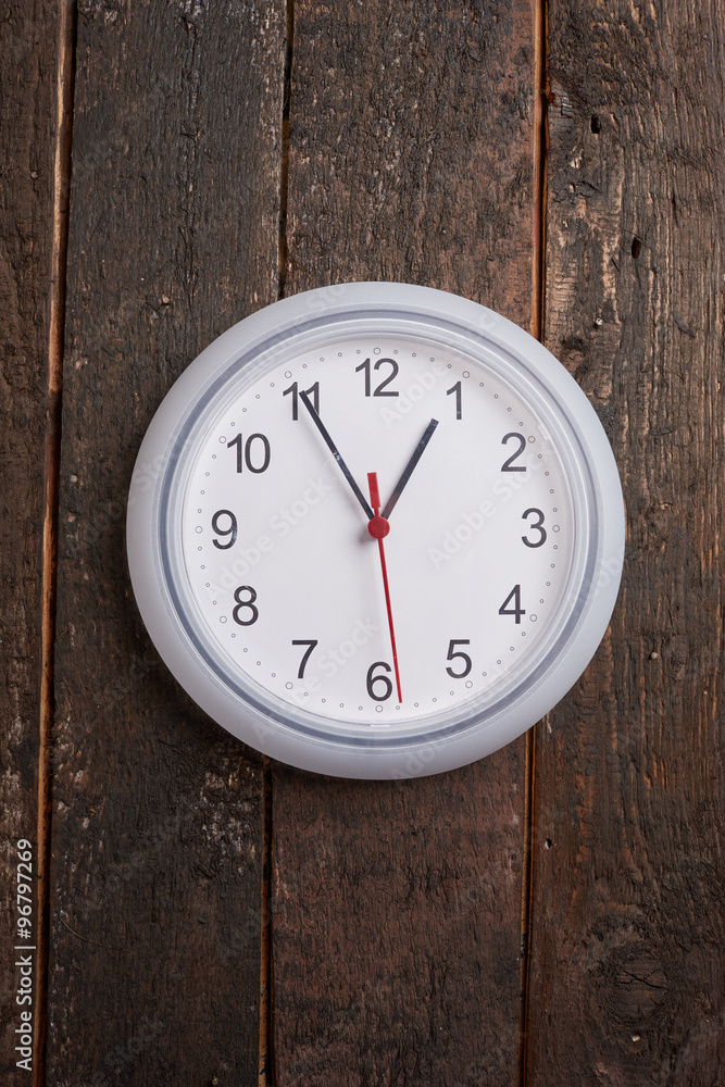 clock on a wooden wall clock on a wooden wall