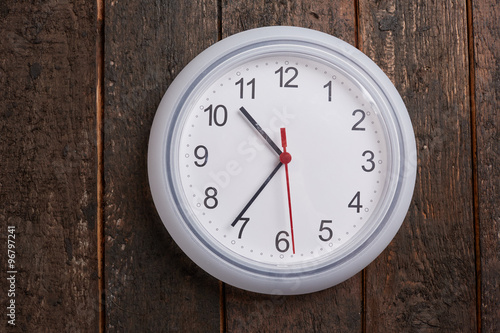 clock on a wooden wall