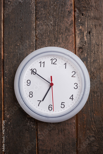 clock on a wooden wall