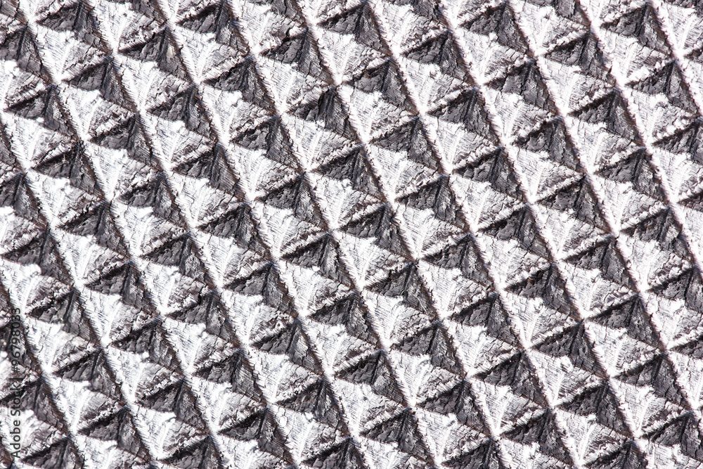 Abstract silver plastic rhombus texture.