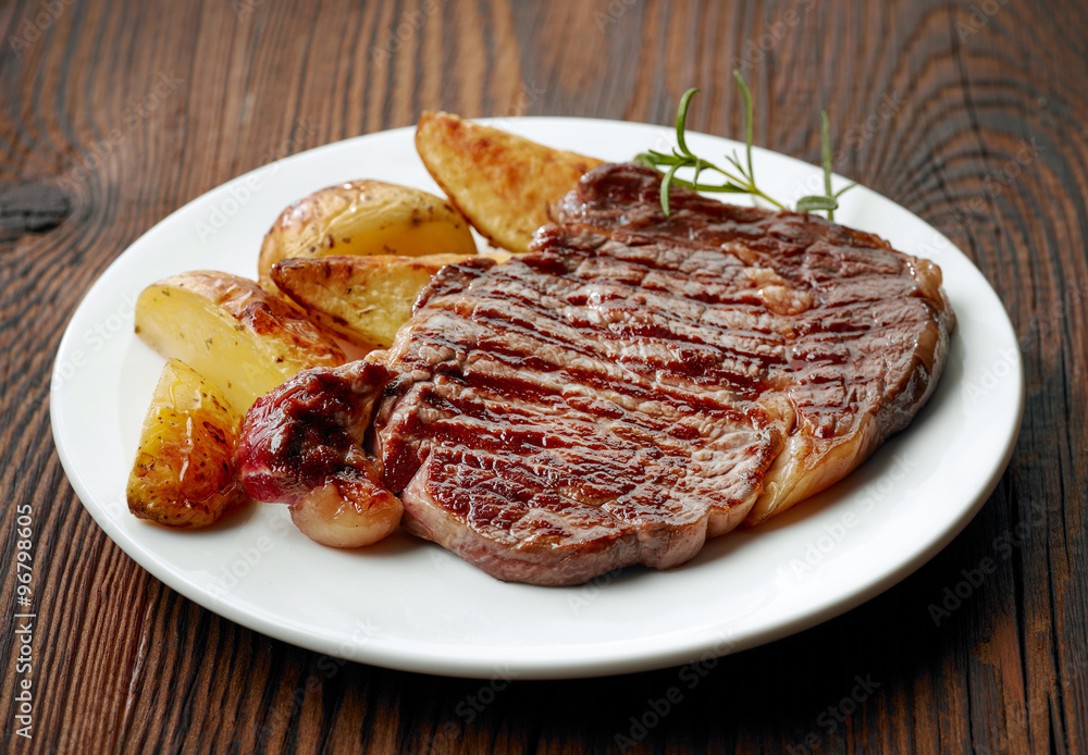 grilled beef steak and potatoes