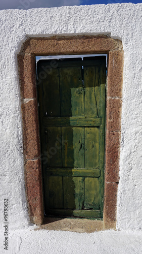 door in small greece village exo gonia on santorini photo