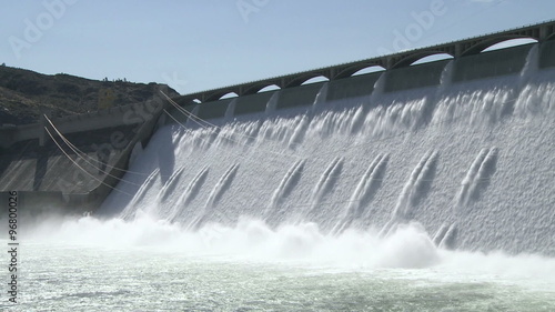 Wide shot of the spillway with power cables on the Grand Coulee hydroelectric dam in Washington, USA