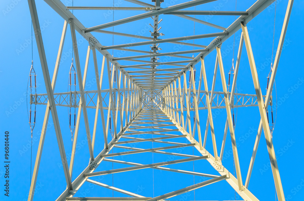 Symmetrical Pylon upwards against blue winter sky