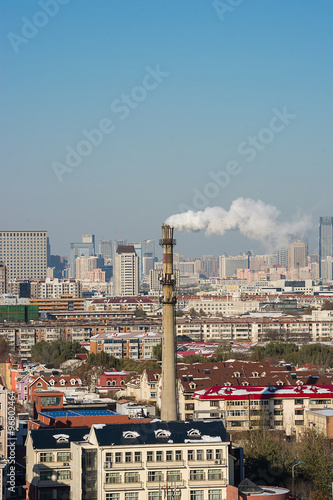 Cityscape of Chimneys tank in middle of the city.
