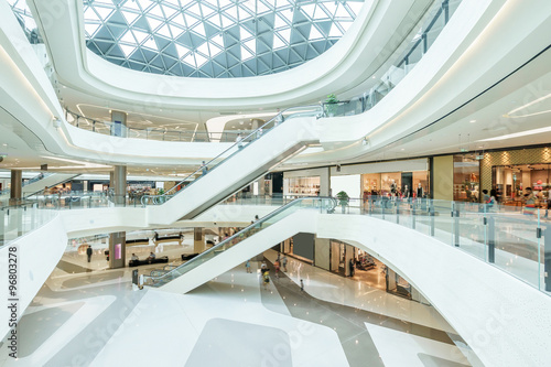 abstract ceiling and escalator in hall of shopping mall photo