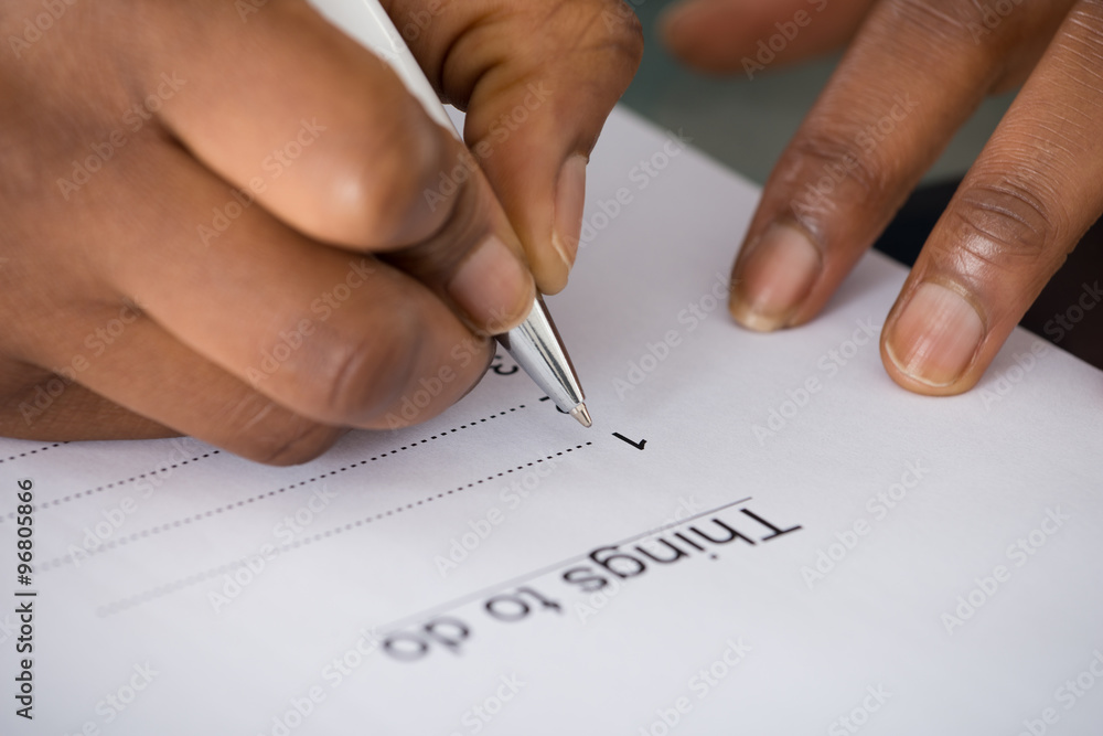 Person's Hand Writing Things To Do List Person's Hand Writing Things To Do List