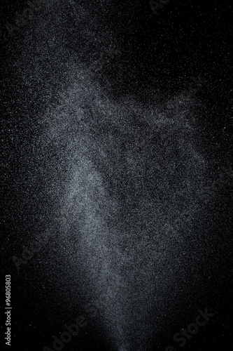 Abstract splashes and drops of water on black background.