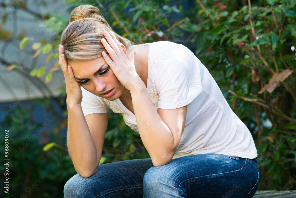 Woman In Casuals Massaging Head Woman In Casuals Massaging Head