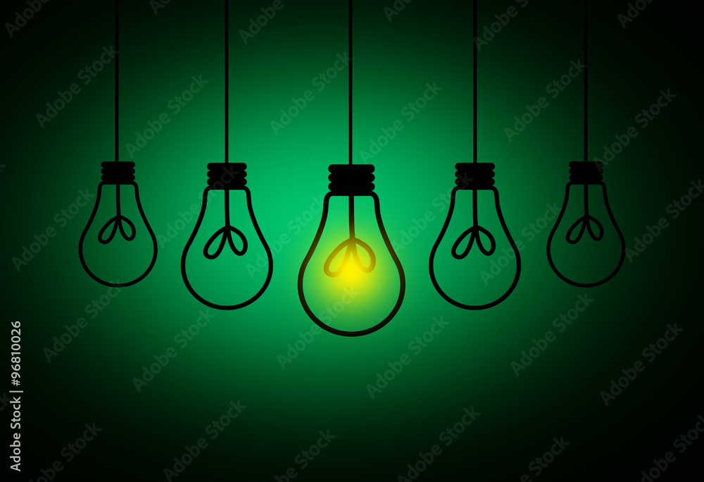 Leadership Concept - One light bulbs with glowing one isolated on green background Leadership Concept - One light bulbs with glowing one isolated on green background