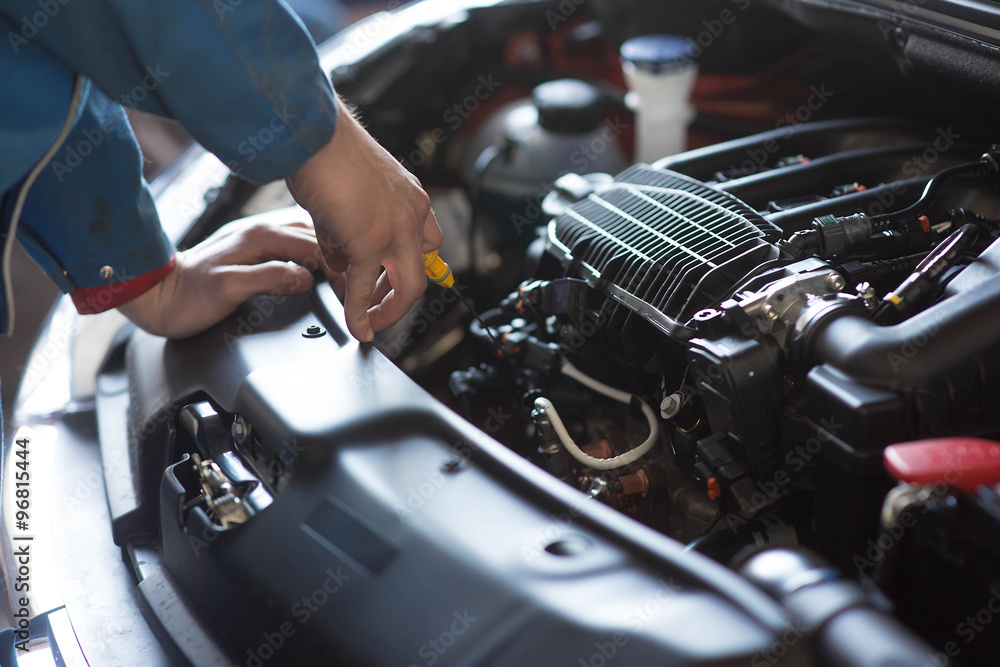 Car mechanic working in auto repair service Car mechanic working in auto repair service