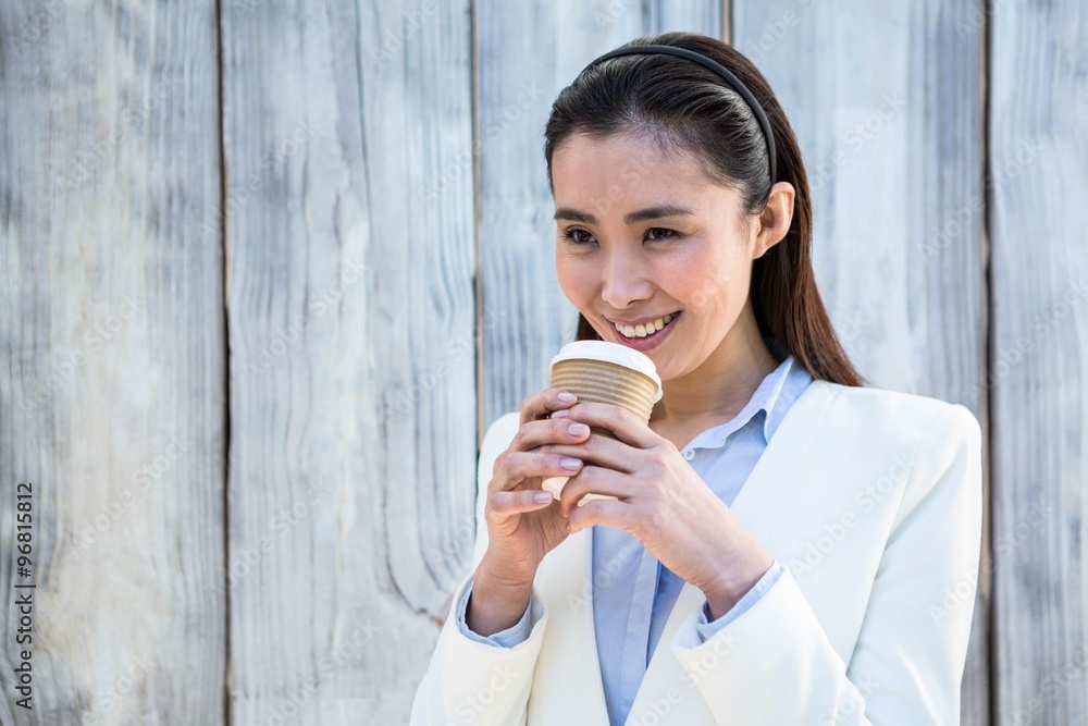Smiling businesswoman with take-away coffee Smiling businesswoman with take-away coffee