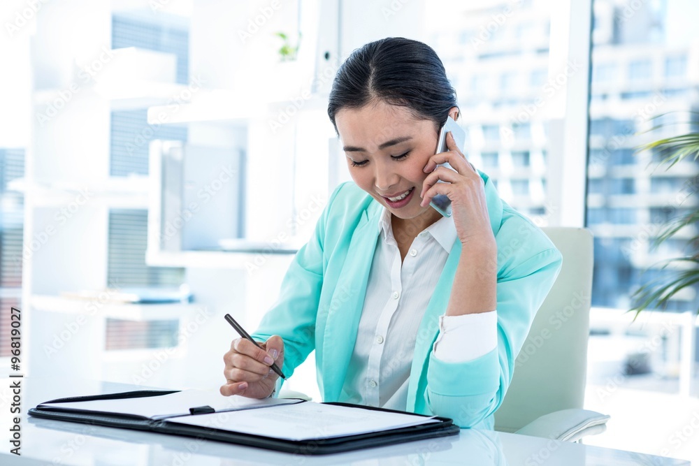 Happy businesswoman sitting down Happy businesswoman sitting down