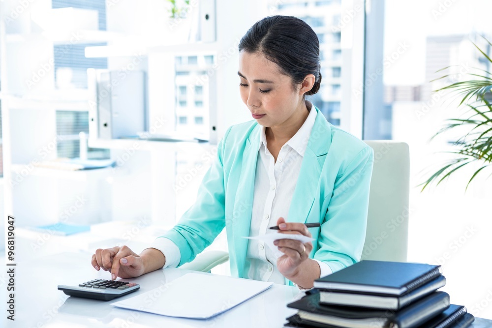 Focused businesswoman working hard Focused businesswoman working hard