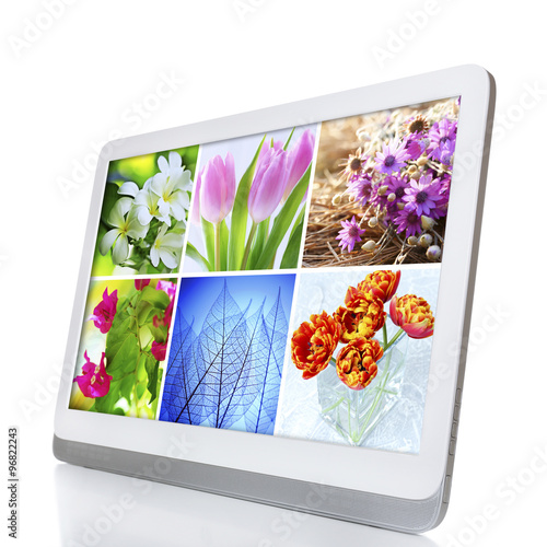 Tablet PC with images of nature objects  isolated on white