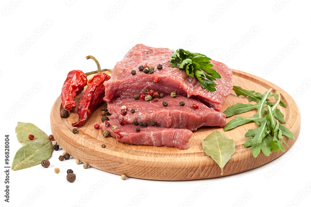 Meat on a cutting board on white background. Meat on a cutting board on white background.
