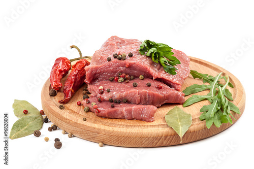 Meat on a cutting board on white background.