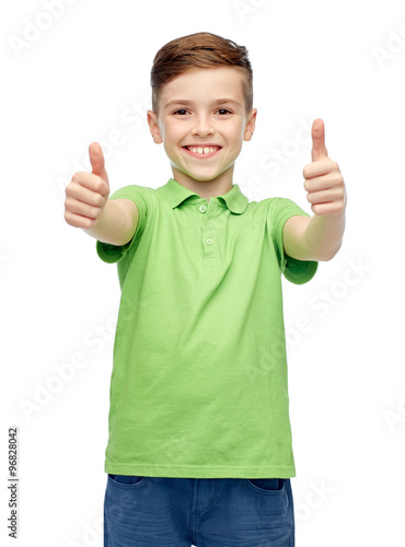 happy boy in green polo t-shirt showing thumbs up