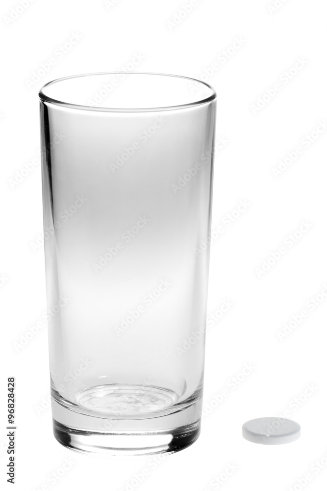 aspirin pills and empty glass isolated on white aspirin pills and empty glass isolated on white