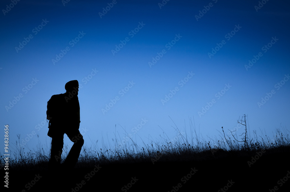 Climber silhouette on the grassland