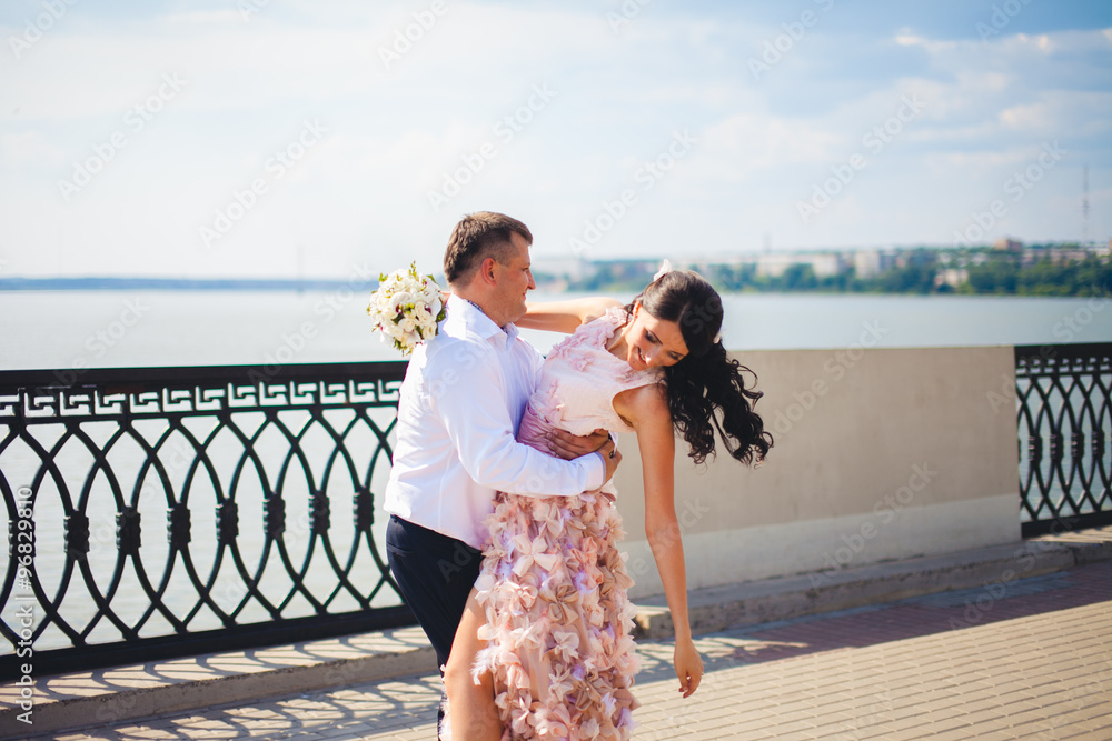 Cute adorable beautiful happy just married couple, stylish bouquet Cute adorable beautiful happy just married couple, stylish bouquet