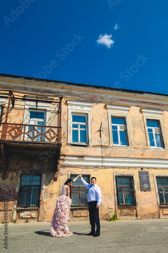 gorgeous beautiful happy young Caucasian couple posing in the city