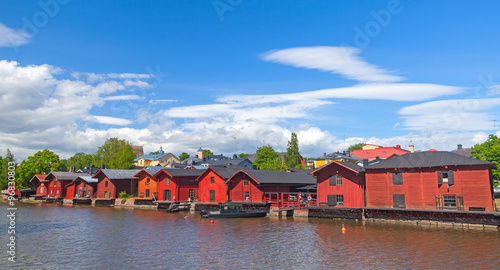 Old red houses on the river coast in Porvoo