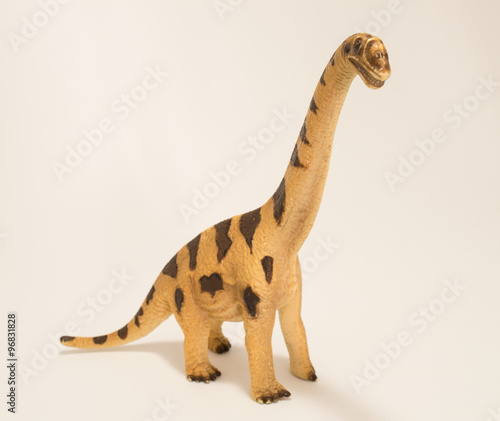 Dilophosaurus dinosaur toy figure isolated on white.