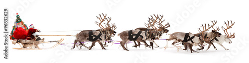 Santa Claus is sitting in a deer sleigh