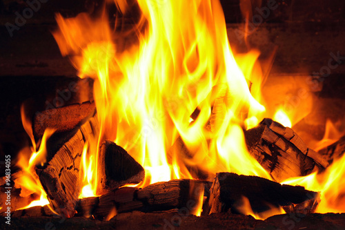 A nice fire with coals in a fire place close-up