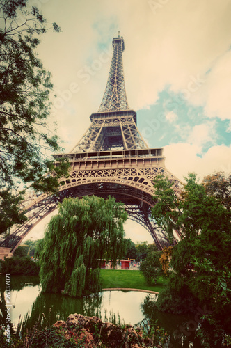 Eiffel Tower from Champ de Mars park in Paris, France. Vintage