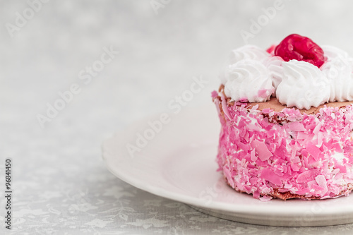 Delicious cake with sour cherries on white background