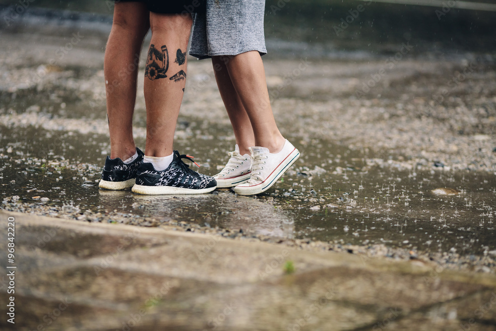 couple on the background of wet asphalt