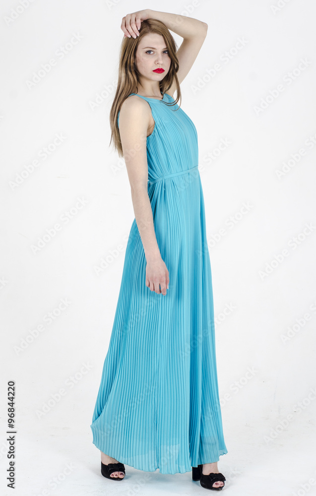 A slender girl with long hair dancing in a long summer dress
A slender girl with long hair dancing in a long summer dress