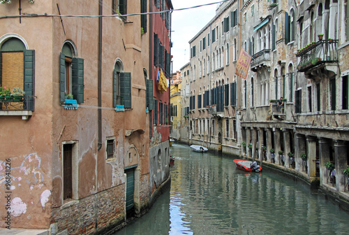 VENICE  ITALY - SEPTEMBER 02  2012  Old typical buildings on narrow channel in Venice  Italy