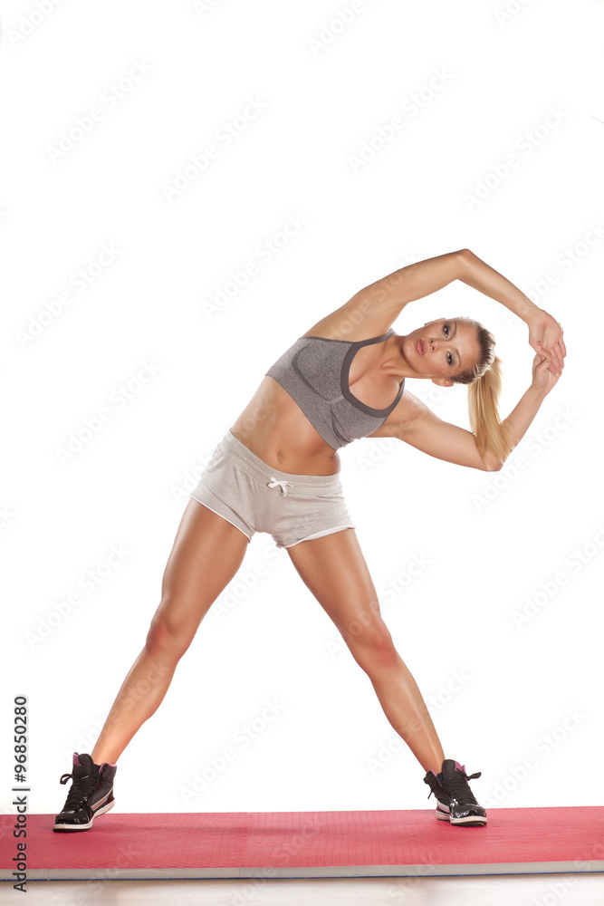 young athletic woman doing exercises young athletic woman doing exercises