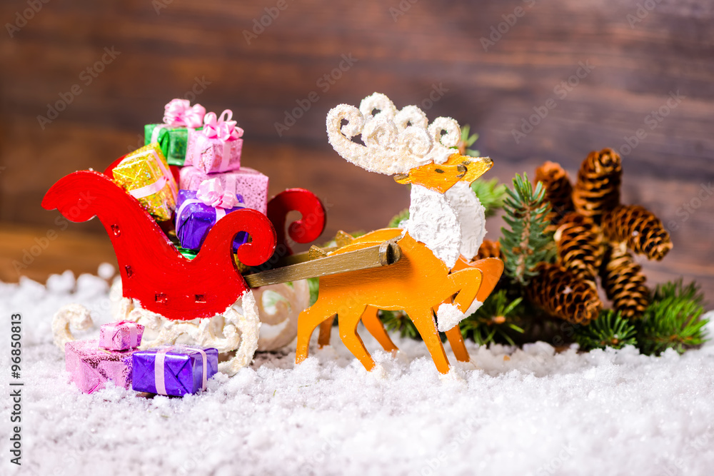 composition of Christmas decoration reindeer and Santa sleigh wi